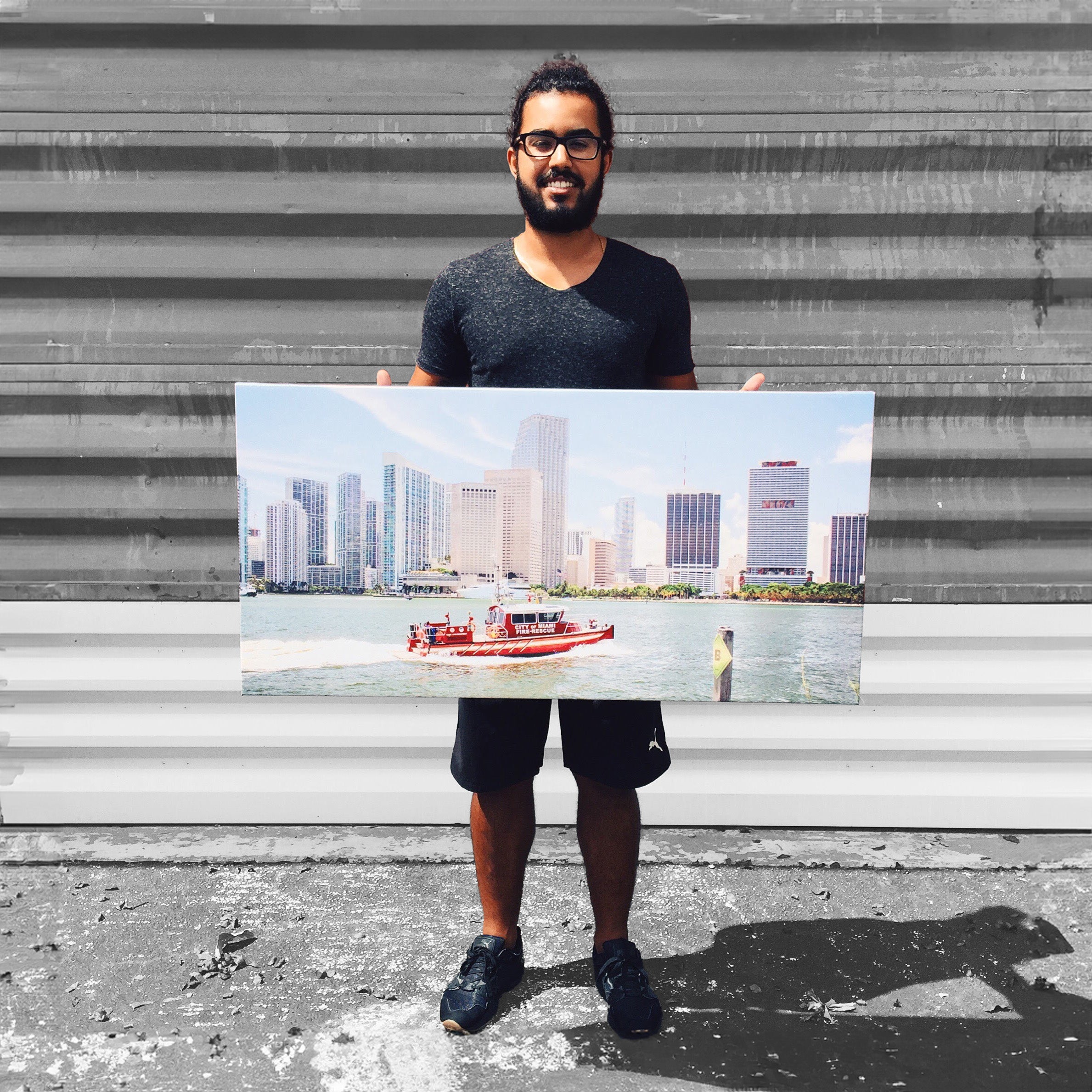 A stretched 40x20 gallery canvas print held by the customer Daniel